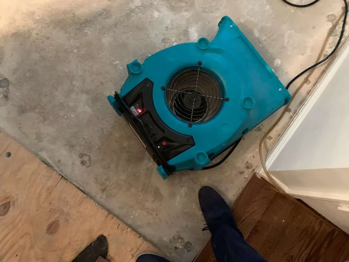 Air mover drying subfloor during Leak Detection & Repair in Sangaree